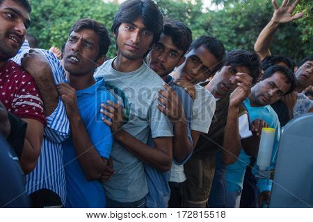 KOS ISLAND, GREECE - SEP 28, 2015: Unknown refugees arriving in Greece by inflatable boats from Turkey. Kos island is located just 4 kilometers from the Turkish coasts.