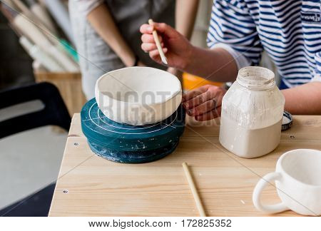 workshop production of ceramic tableware product painting.