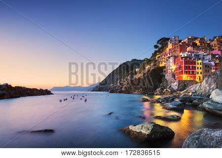 Riomaggiore town cape and sea landscape at sunset. Seascape in Cinque Terre National Park Liguria Italy Europe. Long Exposure