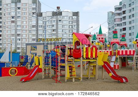GOMEL BELARUS - APRIL 14 2016: Modern children's playground with bright colorful constructions on street Khatayevich Gomel Belarus