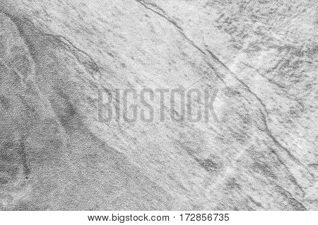 Closeup surface at stone pattern at stone brick wall in the garden textured background in black and white tone