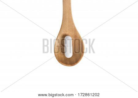 White capsule on a wooden spoon isolated on the white background
