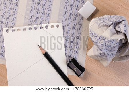 Crumpled Paper Ball Of Vintage Classic Answer Sheet With Pencil, Sharpener And Paper Reduction. Cros