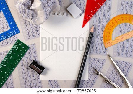 Blank Paper Reduction On Vintage Answer Sheet With Pencil, Sharpener And Drawing Compasses On Set Of