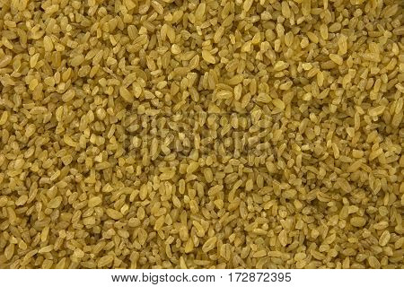 background of dry bulgur wheat from above