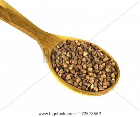 Buckwheat in wooden spoon on a white background