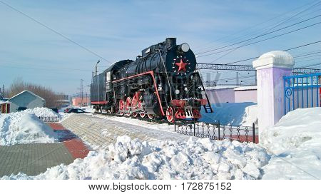 KAMENSK-URALSKIY/ RUSSIA - FEBRUARY 4. Old russian freight locomotive L-4305 on railway station square of the city Kamensk-Uralsky on February 4, 2011. Sverdlovsk region, Russia