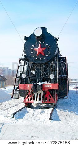 KAMENSK-URALSKIY/ RUSSIA - FEBRUARY 4. Old russian freight locomotive L-4305 on railway station square of the city Kamensk-Uralsky on February 4, 2011. Sverdlovsk region, Russia.