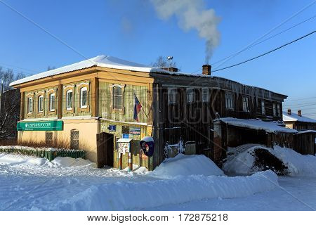 VISIM/ RUSSIA - JANUARY. 8. Old wooden public building in a russian old believer village Visim (former apartment house) on January 8, 2015 in Ural region, Russia.