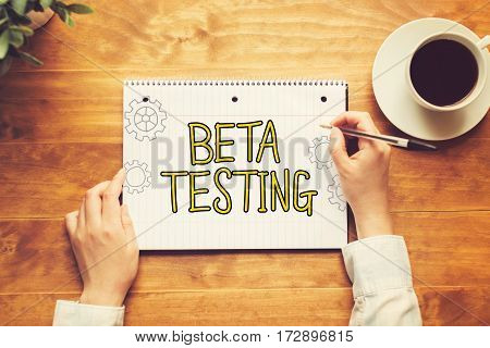 Beta Testing Text With A Person Holding A Pen