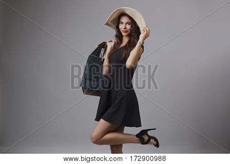 Beautiful woman with shopping bags. Studio shoot