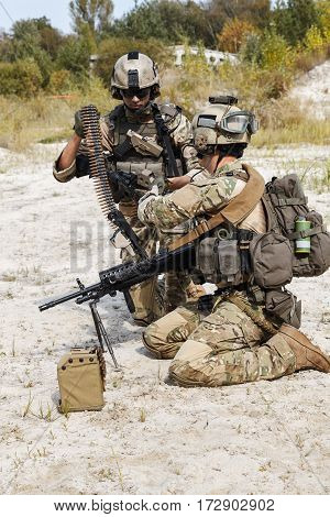 Members of US Army Rangers machinegun crew during the fight in the desert