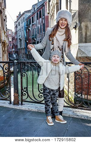 Mother And Daughter Tourists In Venice Having Fun Time