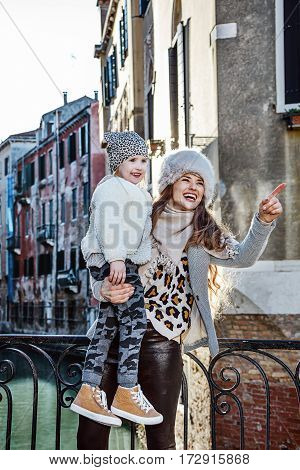 Happy Mother And Child Travellers In Venice, Italy Sightseeing
