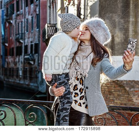 Mother And Daughter Travellers Taking Selfie In Venice, Italy