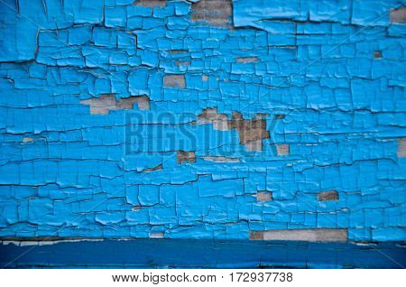Scratched Paint At Blue Wood Wall