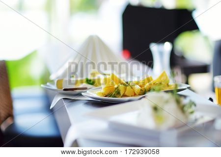 Different Kinds Of Wine Snacks And Variuos Cheeses On White Table
