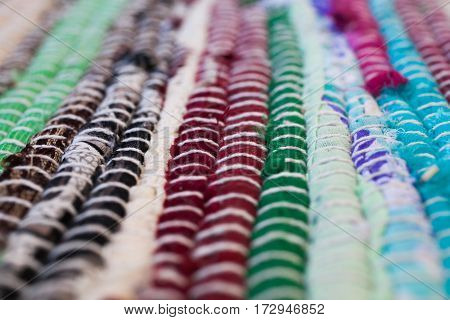 Colorful carpet texture. Background of andalusian carpet. Jarapa. Handmade carpet. Close up of beautiful hand made carpet. Abstract background and texture for designers.