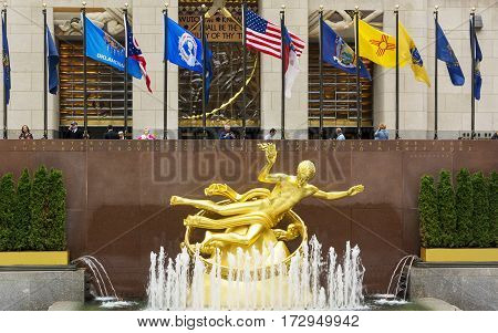 New YOrk, USA, november 2016: The golden Prometheus statue at the Rockefeller center. This bronze gilded statue is located at the front of 30 Rockefeller Plaza