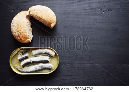 metal can with conserved herring fish, canned marinated herring,  open tin can , Top view.