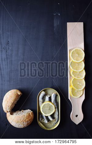 metal can with conserved herring fish, canned marinated herring,  open tin can , Top view.