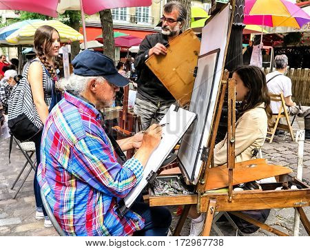 PARIS, FRANCE-JULY, 2016: Montmartre Street Painters, colorful and famous Place du Tertre