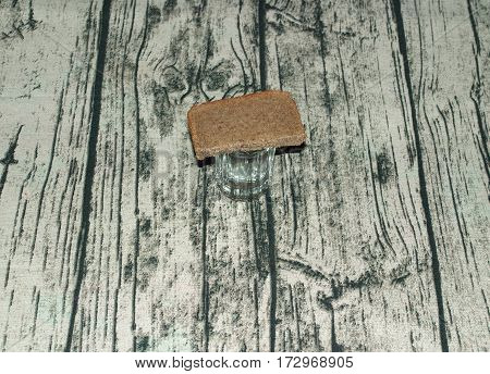 A glass of vodka and black rye bread