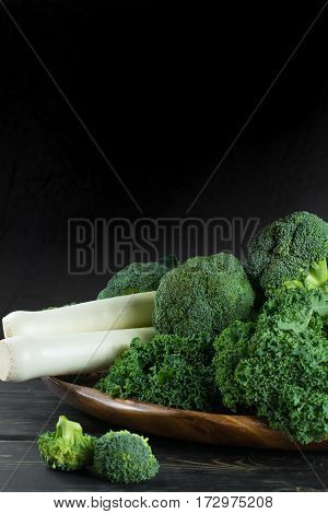 Green winter fresh organic superfood - Kale green cabbage broccoli and leeks prei