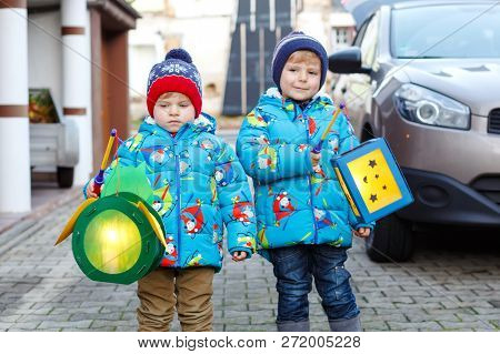 Two Little Kids Boys Holding Selfmade Lanterns For A Halloween Or St. Martin Procession. Beautiful B