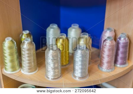 Colorful Embroidery Thread Spool Using In Garment Industry, Row Of Multicolored Yarn Rolls, Sewing M