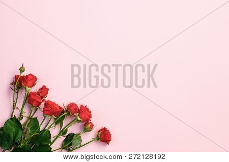 Red Roses Bouquet And Free Space For Text On Pink Background. Flat Lay. Valentine Day Card. Top View
