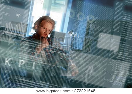 Young Concentrated Computer Developer Writing New Code