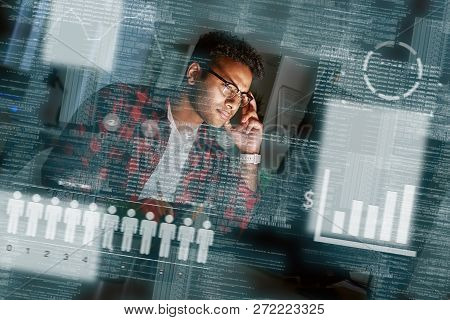 Young Concentrated Indian Seo Specialist Looking Over Advertising Conversion