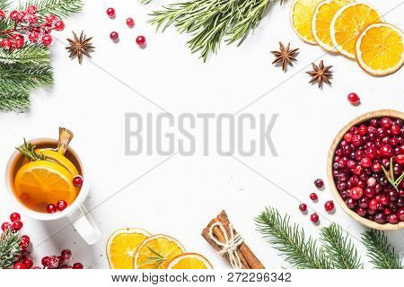 Christmas Food Drink Background. Winter Fruit Tea From Cranberry, Rosemary, Orange And  Anise On Whi