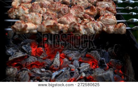 Meat And Vegetable Kebabs On The Hot Bbq Grill. Flaming Charcoal In The Background. Snack For Outdoo