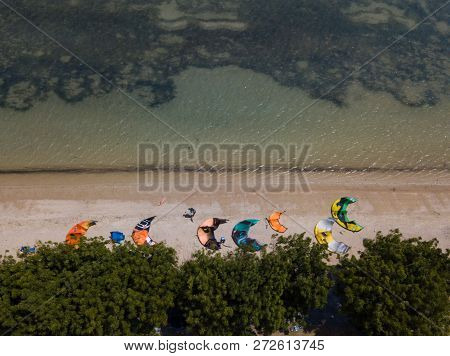 Mui Ne, Vietnam - 11 2018: Kiteboarding, Kite Surf. Extreme Sport Kitesurfing In Tropical Blue Ocean