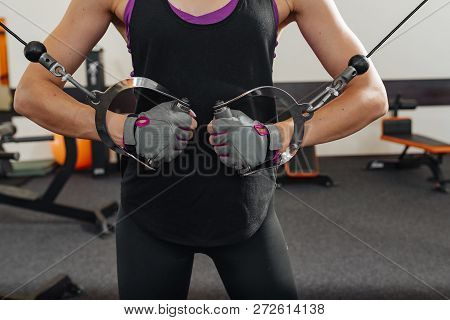 Woman Holding Metal Ring And Doing Lunges Exercises For Hands Muscle Workout Training In Gym.