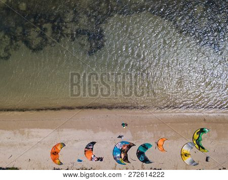 Mui Ne, Vietnam - 11 2018: Kiteboarding, Kite Surf. Extreme Sport Kitesurfing In Tropical Blue Ocean