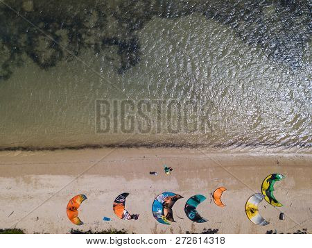 Mui Ne, Vietnam - 11 2018: Kiteboarding, Kite Surf. Extreme Sport Kitesurfing In Tropical Blue Ocean