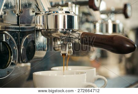 Preparing To Perfection. Small Cups To Serve Hot Coffee Drinks. Coffee Cups. Coffee Being Brewed In 