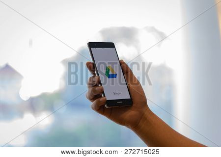 Chiang Mai, Thailand - Oct. 28,2018: Man Holding Huawei With Dropbox On Screen. Dropbox Is A Service