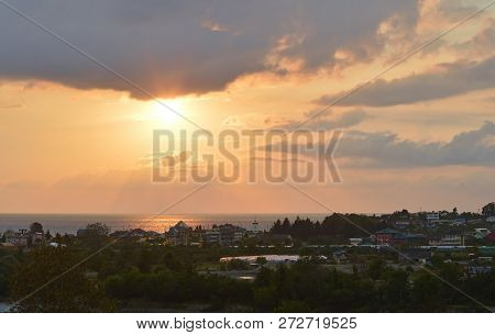 Sunset Over A Small Southern City On The Black Sea Coast. The Village Of Golovinka (lazarevsky Distr