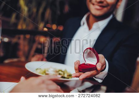 Close Up Handsome Man Proposing To Girlfriend. Romantic Couple In Love Dating. Cutel Man And Girl In