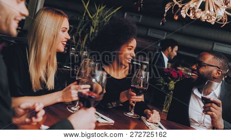 Group Business People Geting Order In Restaurant. Businessmans Having Meeting In Indoor Restaurant. 