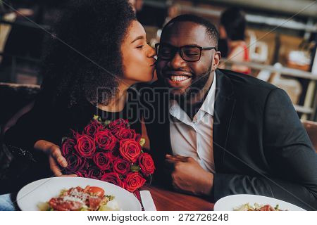African American Couple Dating In Restaurant. Romantic Couple In Love Dating. Cutel Man And Girl In 