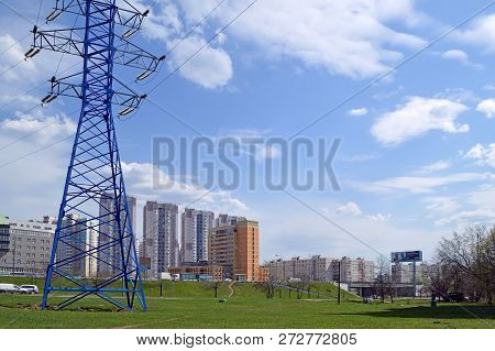 Moscow, Russia - May, 2017: Blue Power Line Support Against The Background Of Residential And Office