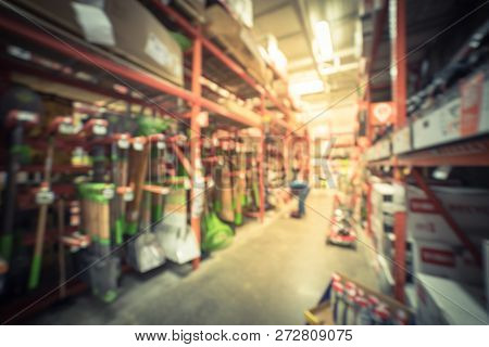 Filtered Tone Blurry Background Customer Shopping For Garden Tools Display At Hardware Store