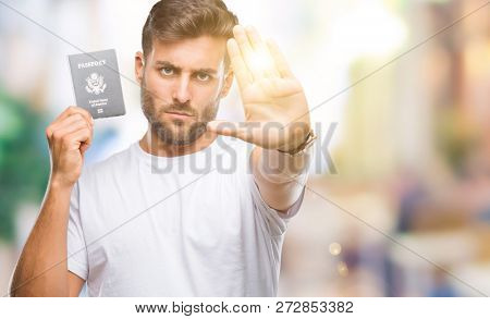 Young handsome man holding passport of united states over isolated background with open hand doing stop sign with serious and confident expression, defense gesture