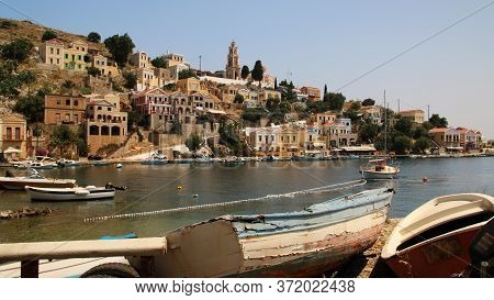 Symi, Greece - June 14, 2020: Fishing Boats In The Port Of Symi Town, Symi Island, Greece