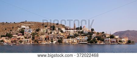 Symi, Greece - June 05, 2020: Symi Town, Symi Island, Pictorial View Of Colorful Houses And The Harb